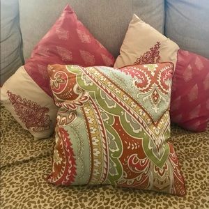 3 throw pillows. Never used. 1 Paisley and 2 burnt orange lumbar pillows.